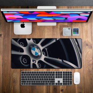 BMW M Performance Wheel desk mat — silver, black and blue design, available in M, L, XL and XXL sizes.