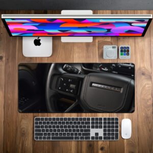Defender Signature Steering desk mat — black leather and brushed metal design, available in M, L, XL and XXL sizes.