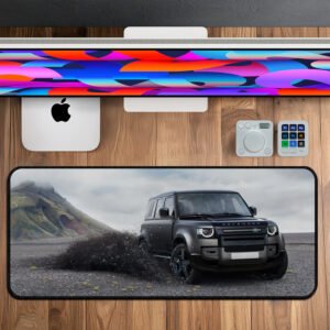 Defender SUV splashing through mud printed on premium desk mat.