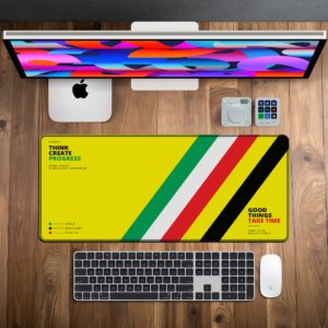 Ascend Amber Desk Mat — sunshine yellow, green, white, red and black design, available in M, L, XL and XXL sizes.