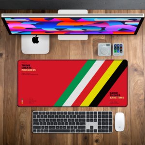 Ascend Tricolor Desk Mat — racing red, green, white, yellow and black design, available in M, L, XL and XXL sizes.