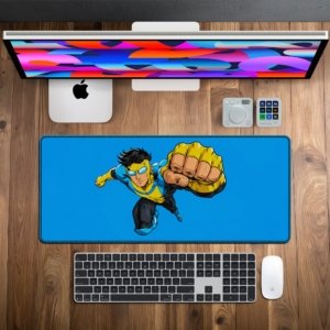 Flying Fist Hero Desk Mat on a desk