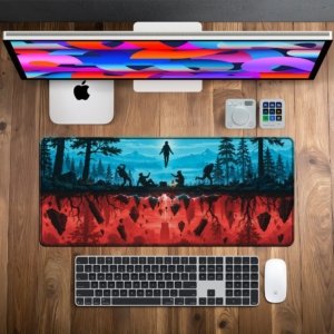 Twin Worlds Forest Desk Mat on a desk