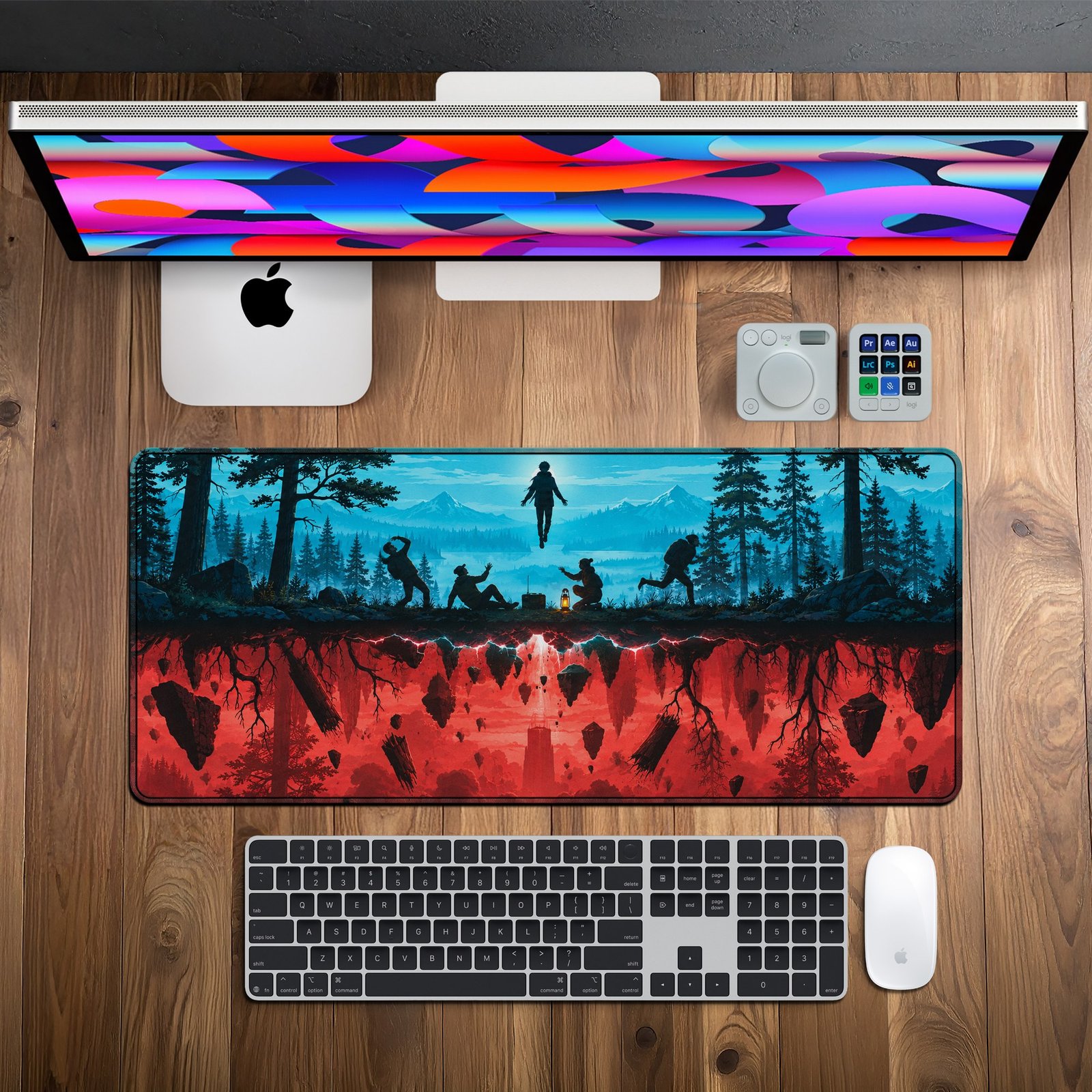 Twin Worlds Forest Desk Mat — cyan blue, red and black design, available in M, L and XL sizes. Twin Worlds Forest Desk Mat on a wooden desk with monitor, keyboard and mouse