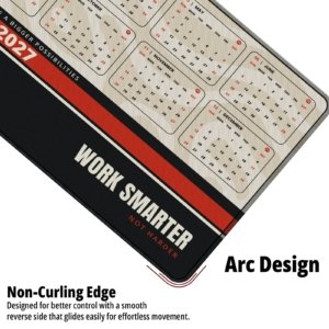 Close-up of the Work Smarter 2027 Calendar Desk Mat showing the non-curling arc edge